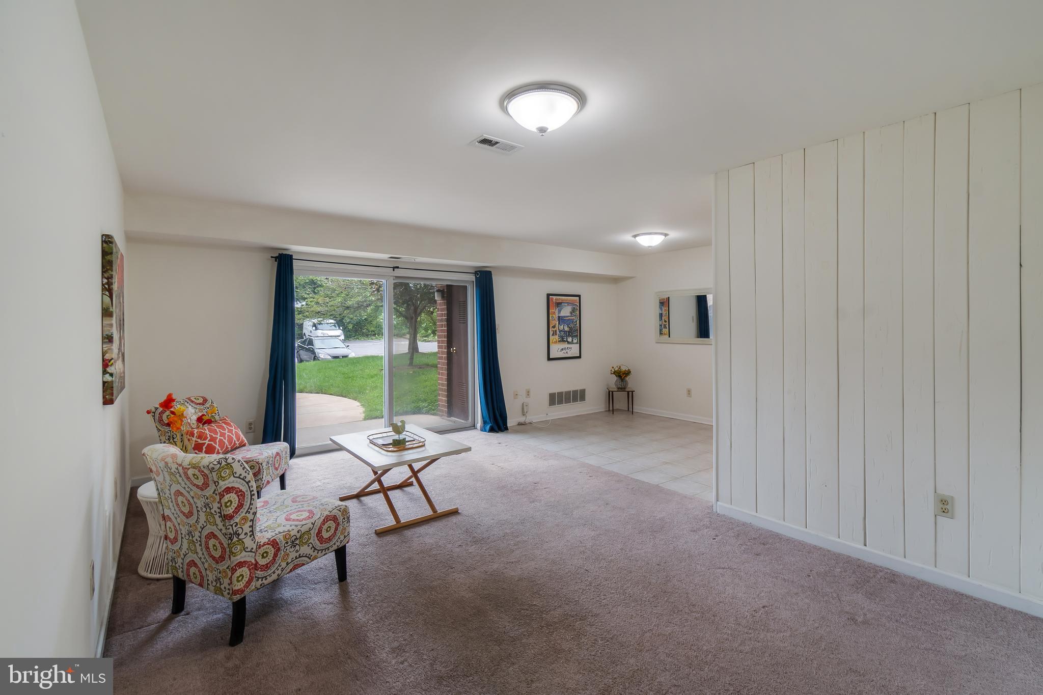 106 Mountain Road, Unit 1A Pasadena, MD 21122 - Photo 4 of 29 a living room with furniture and a window
