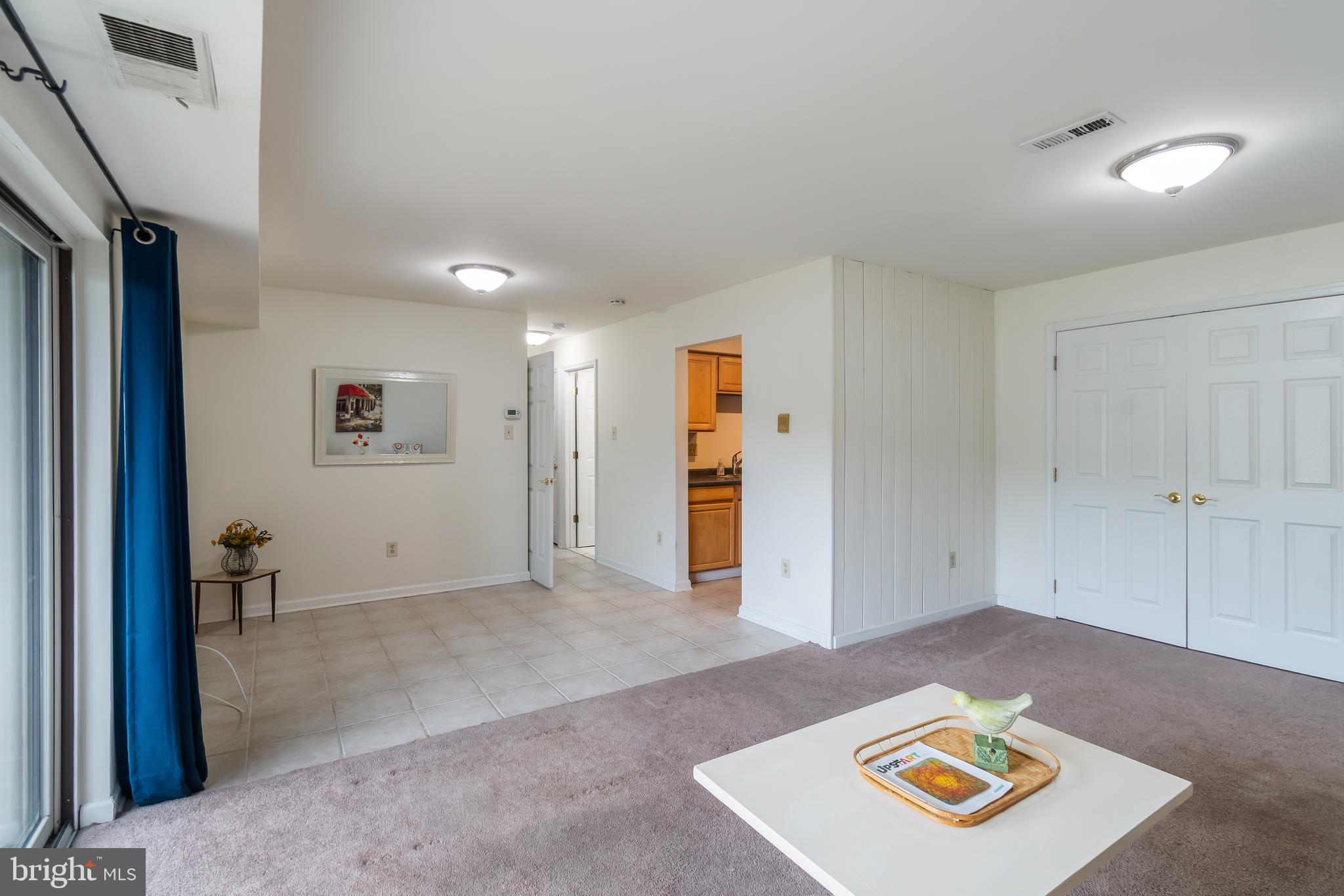 106 Mountain Road, Unit 1A Pasadena, MD 21122 - Photo 5 of 29 a view of an empty room and a window