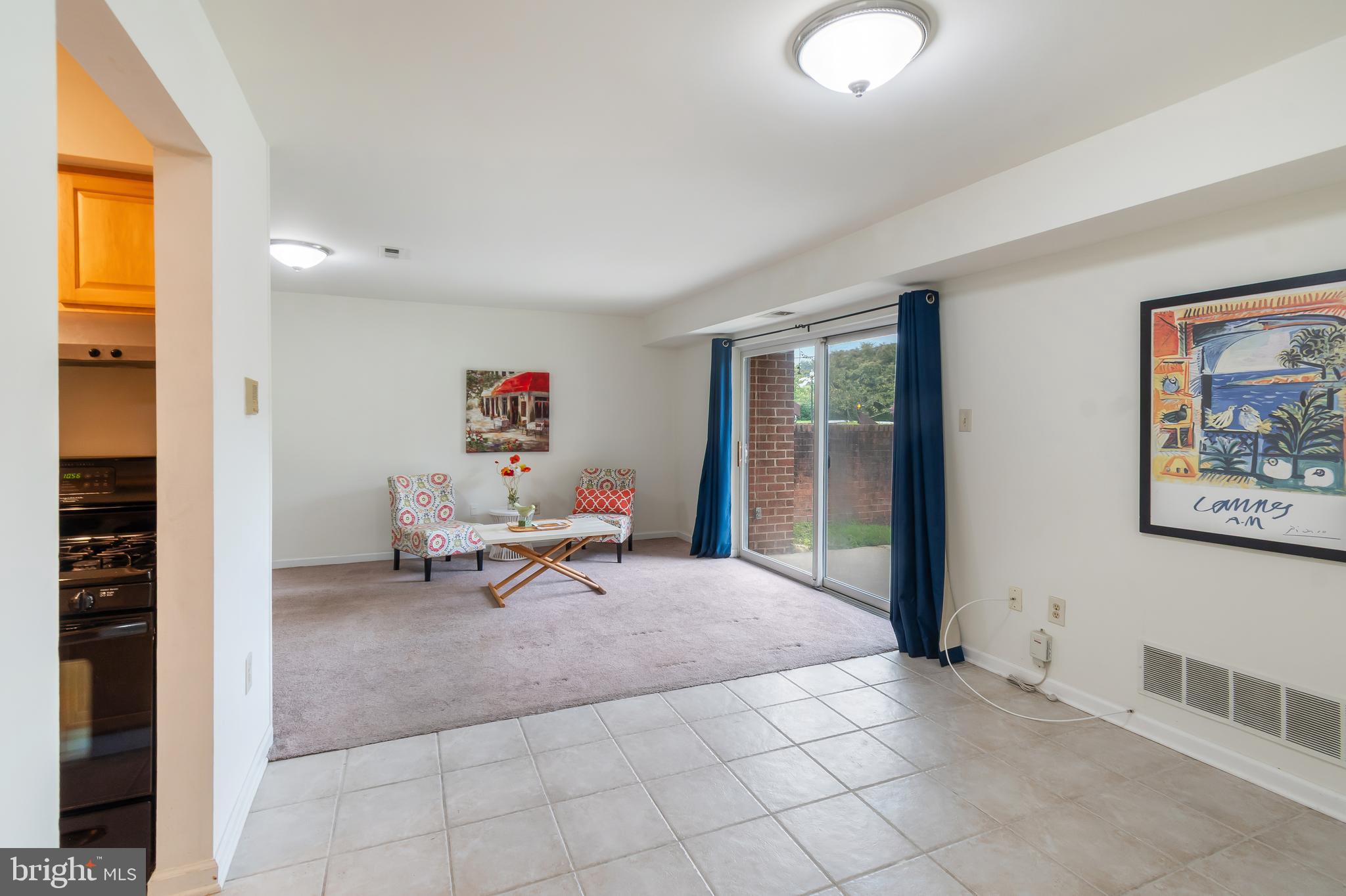 106 Mountain Road, Unit 1A Pasadena, MD 21122 - Photo 8 of 29 a living room with furniture and a window