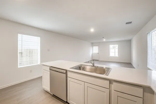 a kitchen with sink and window