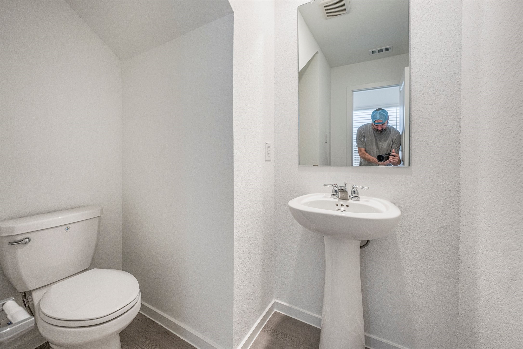 919 Pertuso Lane Huffman, TX 77336 - Photo 15 of 24 a bathroom with a toilet sink and mirror