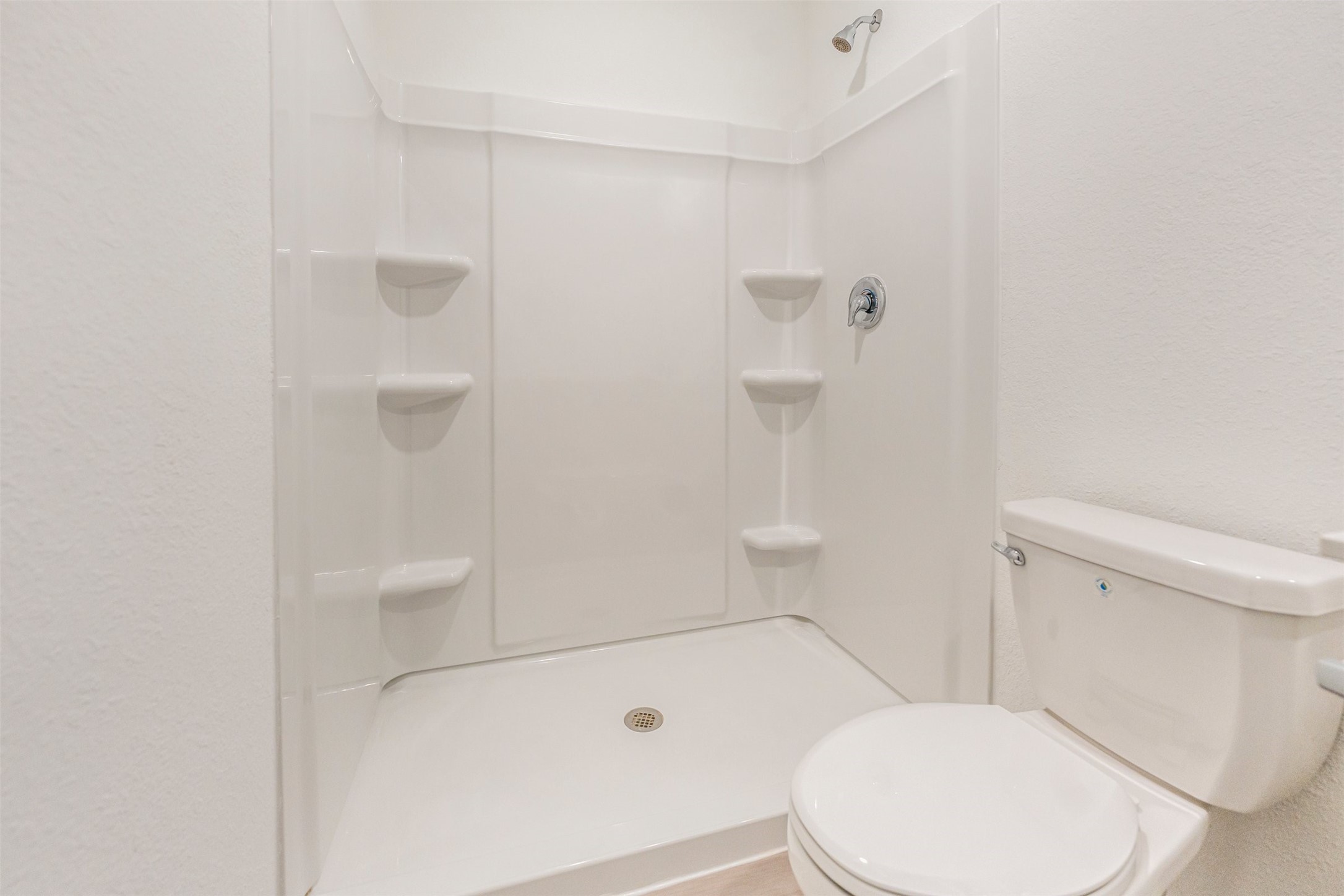 919 Pertuso Lane Huffman, TX 77336 - Photo 16 of 24 a white toilet sitting next to a bath tub