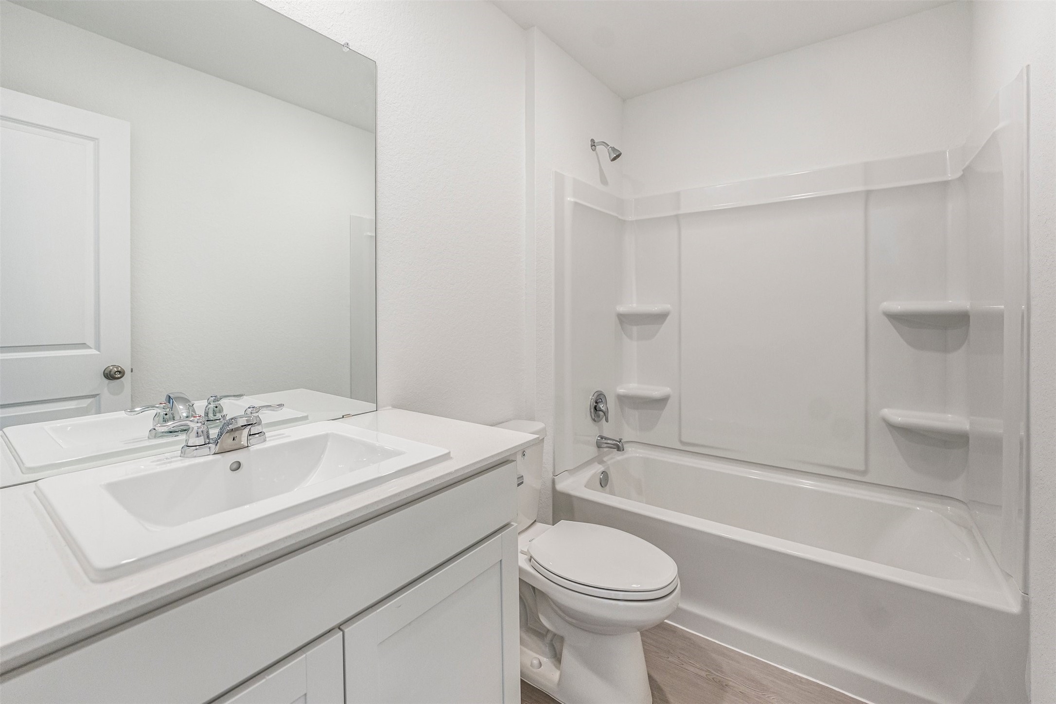919 Pertuso Lane Huffman, TX 77336 - Photo 17 of 24 a bathroom with a sink a toilet and shower