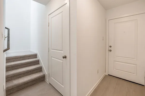 a view of staircase with white walls