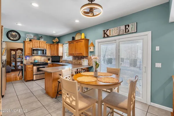 a kitchen with a table and chairs in it