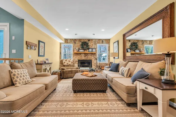 a living room with furniture and a fireplace