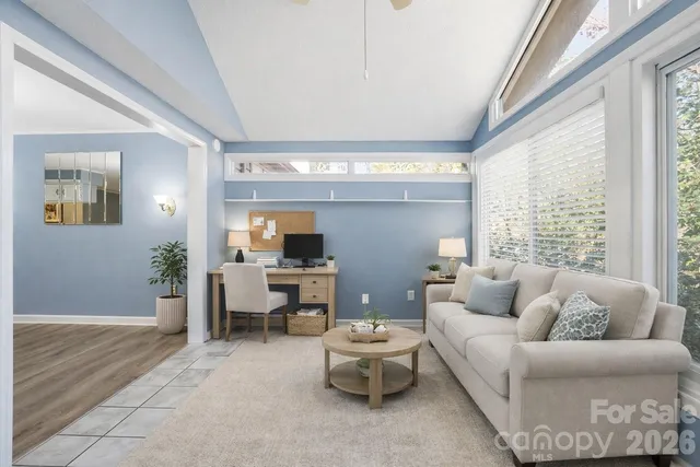 a living room with furniture and a large window