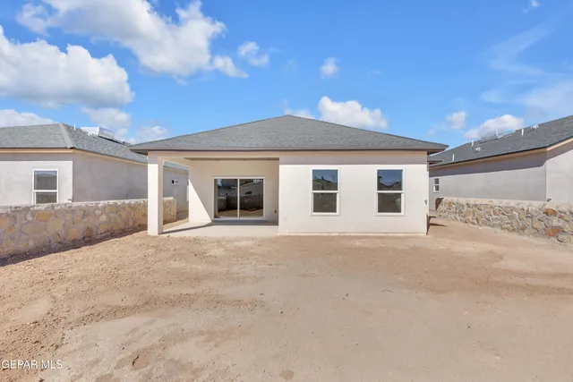 a front view of a house with a garage