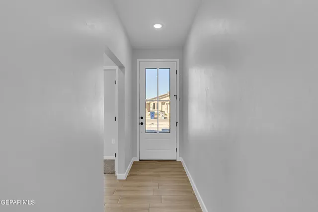 a view of entryway with wooden floor