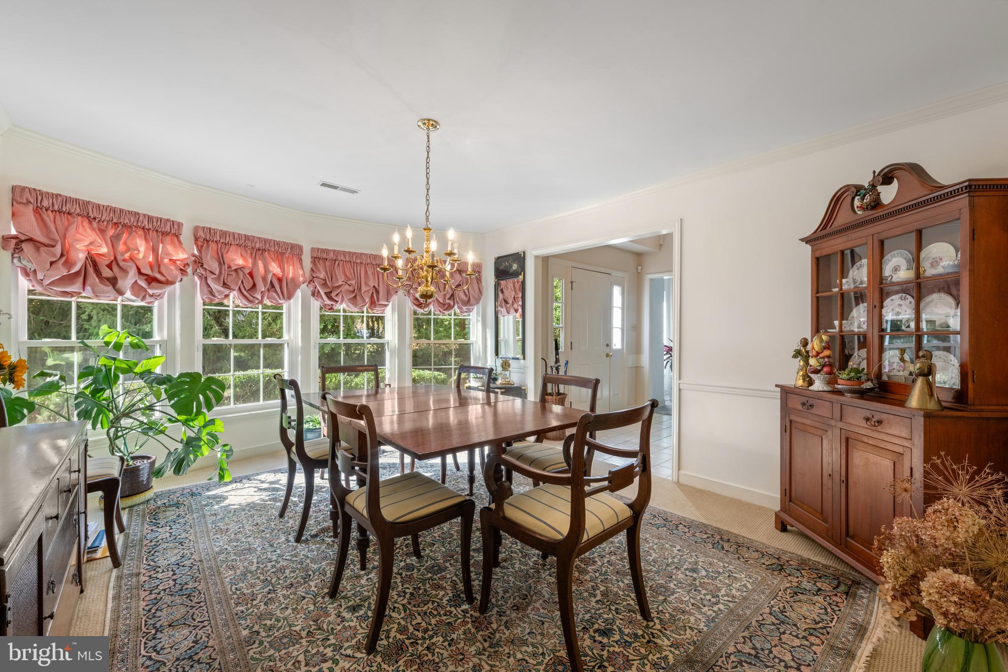32 Manchester Court, Unit 32 Berwyn, PA 19312 - Photo 13 of 27 a dining room with furniture and window