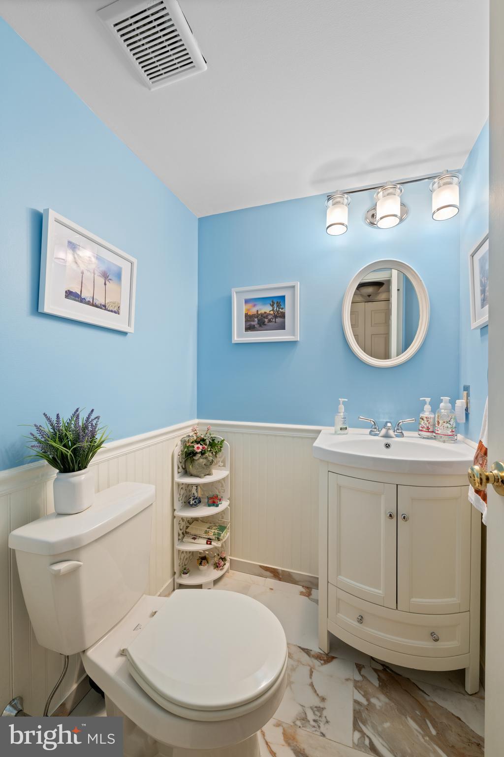 32 Manchester Court, Unit 32 Berwyn, PA 19312 - Photo 18 of 27 a bathroom with a toilet a sink and mirror