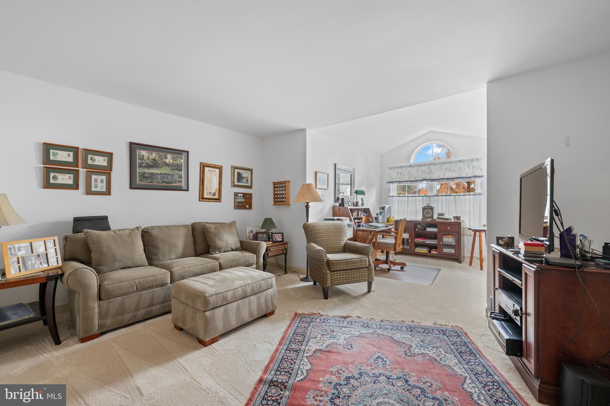32 Manchester Court, Unit 32 Berwyn, PA 19312 - Photo 25 of 27 a living room with furniture potted plant and a window