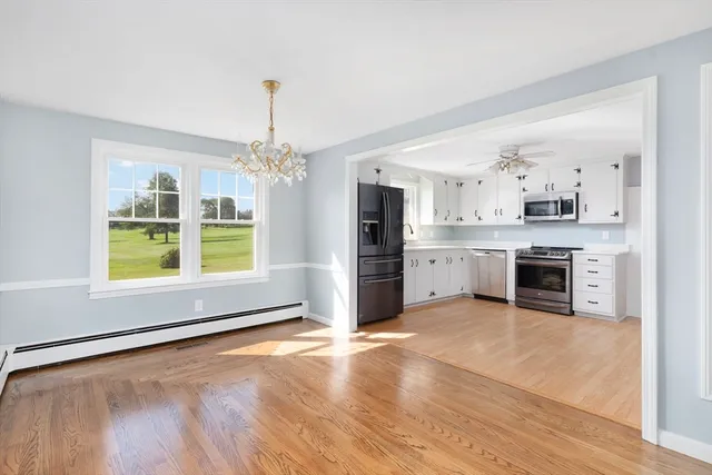 a large kitchen with cabinets and stainless steel appliances