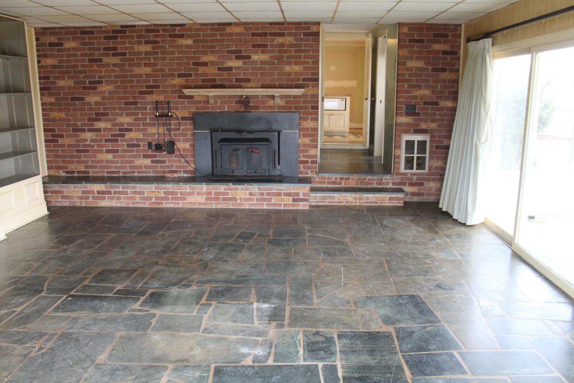 1153 Carters Island Road Goodview, VA 24095 - Photo 23 of 29 a view of empty room with fireplace and window