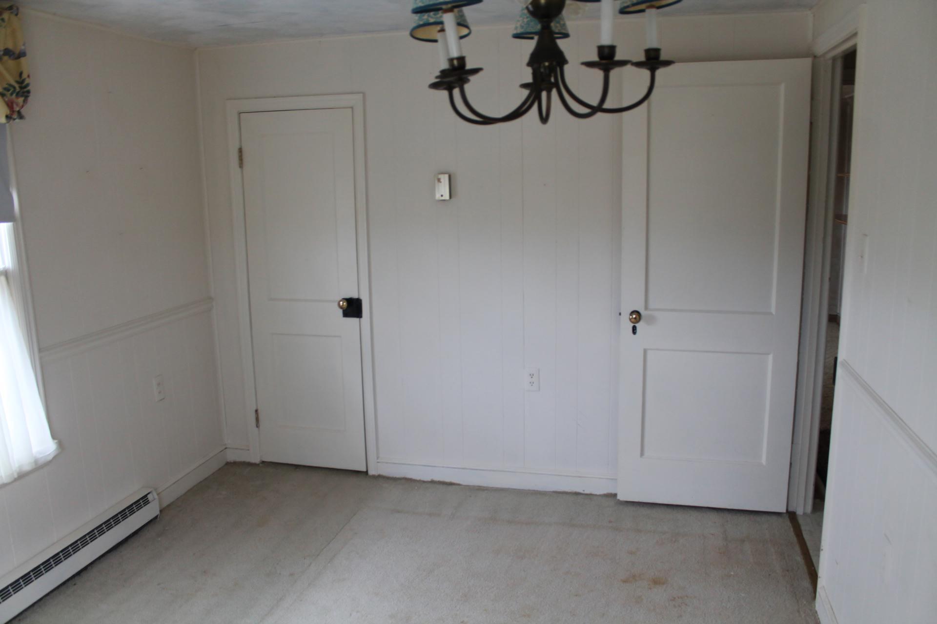 1153 Carters Island Road Goodview, VA 24095 - Photo 29 of 29 a view of a room with rack on the wall and a window
