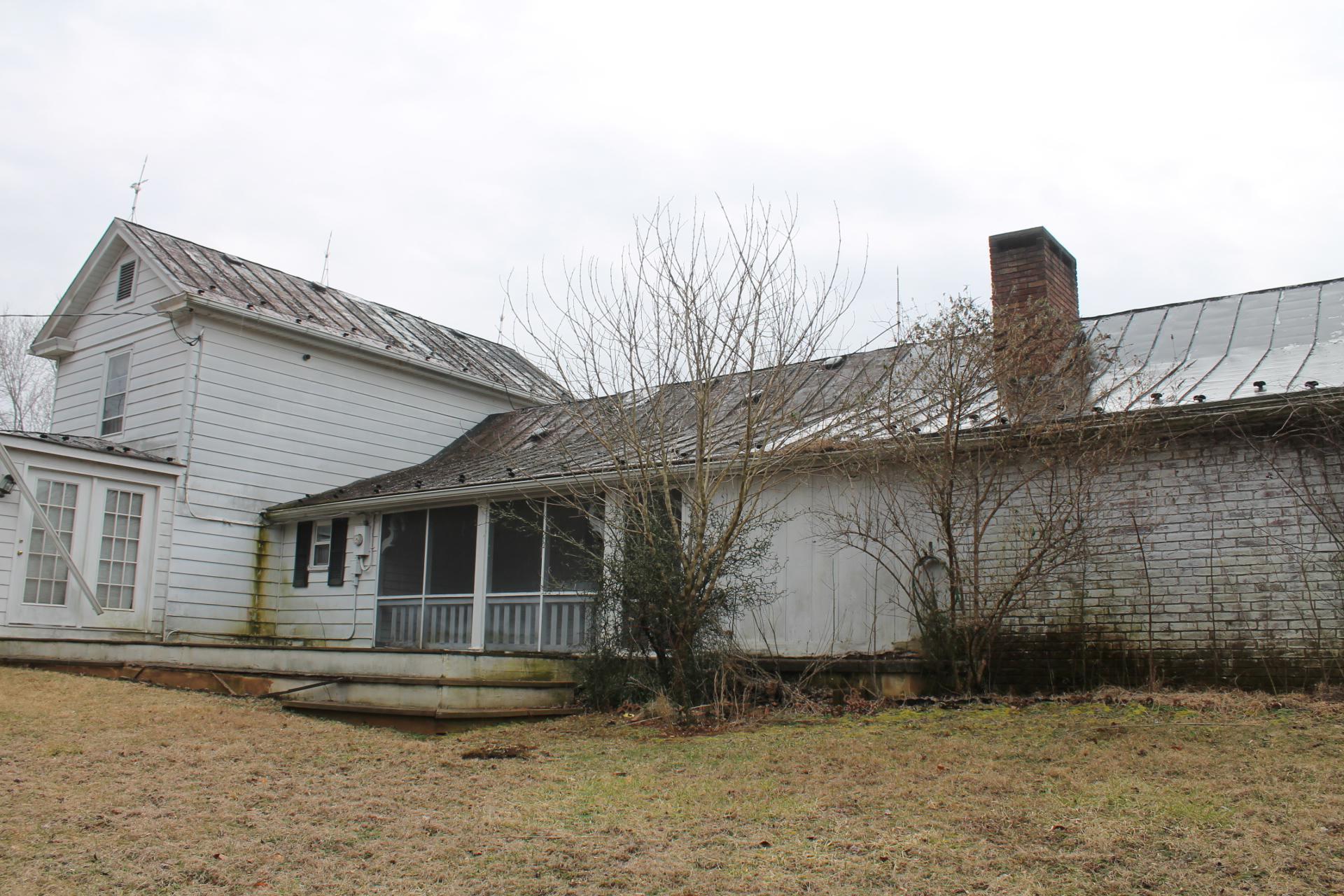1153 Carters Island Road Goodview, VA 24095 - Photo 7 of 29 a front view of a house with garden