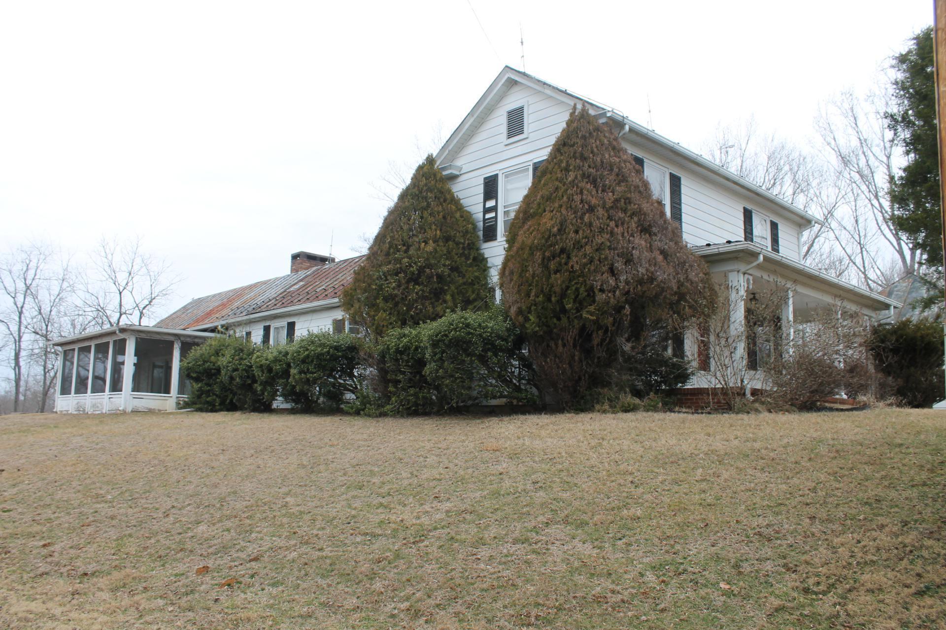 1153 Carters Island Road Goodview, VA 24095 - Photo 9 of 29 a view of a white house with a yard