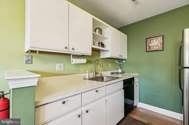 a kitchen with a sink and cabinets