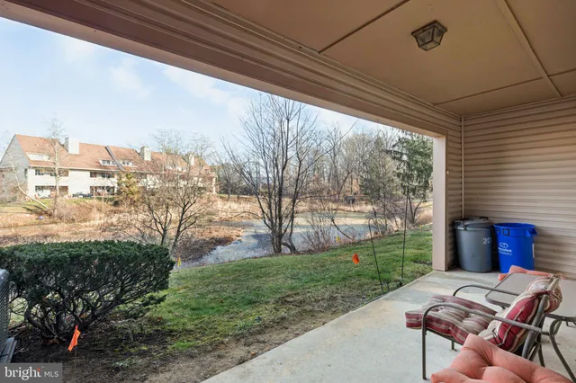 a view of a houses with yard and mountain view