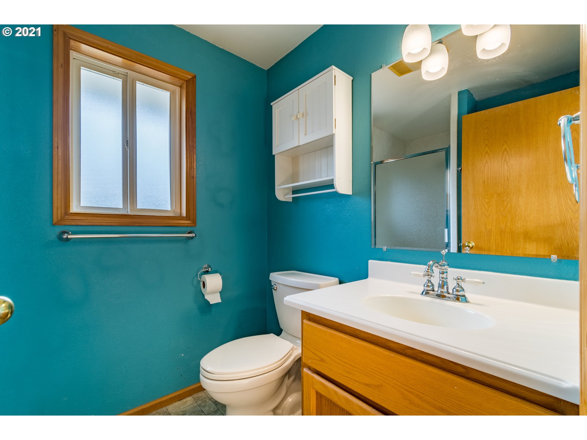 3139 W Street Springfield, OR 97477 - Photo 22 of 32 a bathroom with a sink mirror and toilet