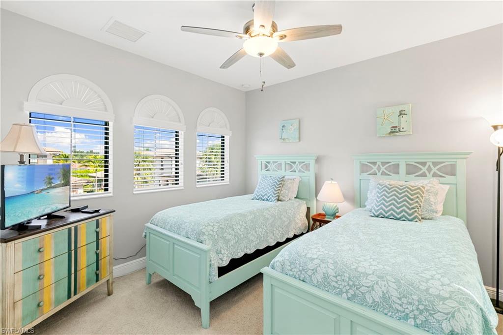 1350 Kendari Terrace Naples, FL 34113 - Photo 17 of 47 Bedroom featuring light colored carpet and ceiling fan