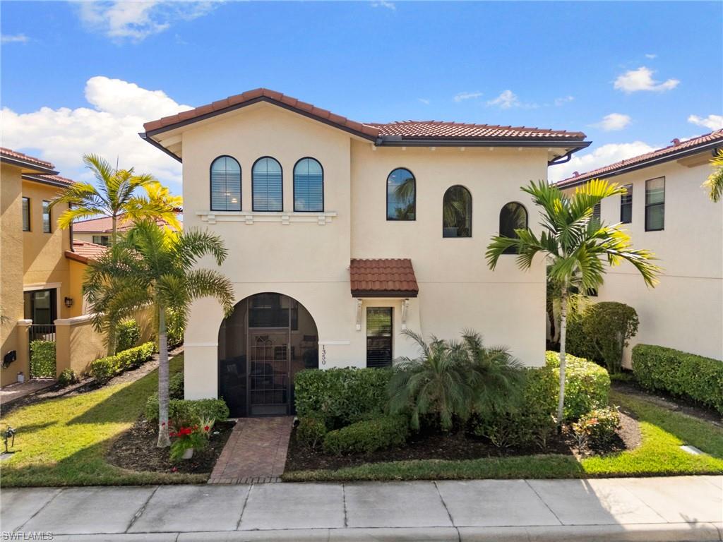 1350 Kendari Terrace Naples, FL 34113 - Photo 2 of 47 Mediterranean / spanish-style home featuring a tiled roof and stucco siding