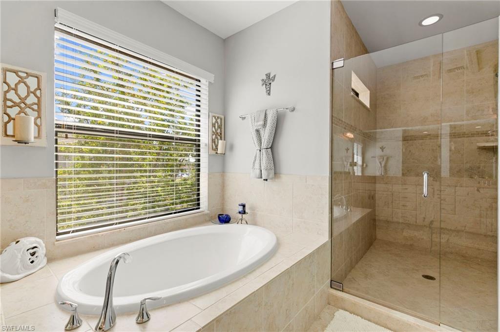 1350 Kendari Terrace Naples, FL 34113 - Photo 21 of 47 Full bathroom with a bath and a shower stall