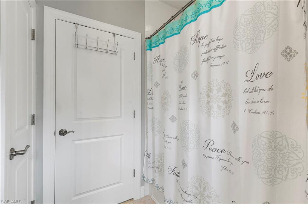 1350 Kendari Terrace Naples, FL 34113 - Photo 25 of 47 Bathroom with a shower with shower curtain