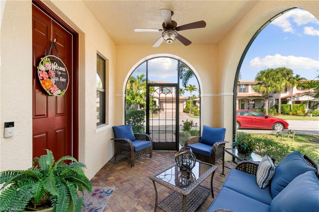 1350 Kendari Terrace Naples, FL 34113 - Photo 29 of 47 Sunroom featuring brick flooring, a textured wall, and a textured ceiling