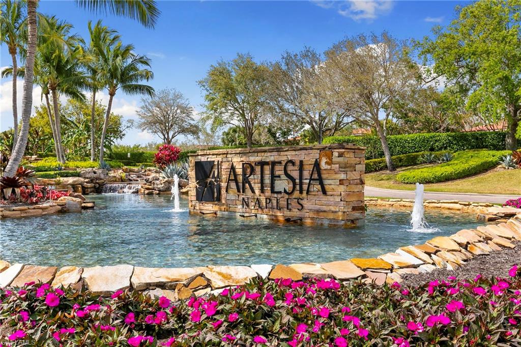 1350 Kendari Terrace Naples, FL 34113 - Photo 31 of 47 Community / neighborhood sign with a small pond