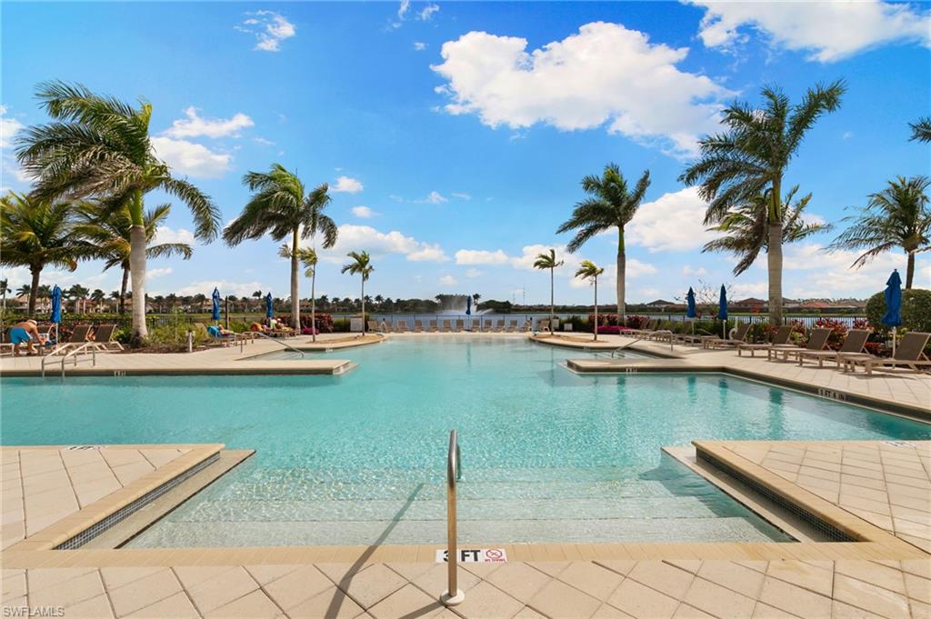 1350 Kendari Terrace Naples, FL 34113 - Photo 35 of 47 Community pool featuring a patio area