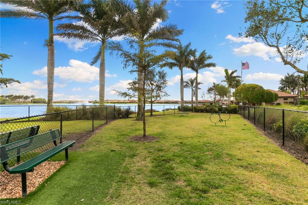 1350 Kendari Terrace Naples, FL 34113 - Photo 41 of 47 View of yard featuring a dog friendly area and a water view