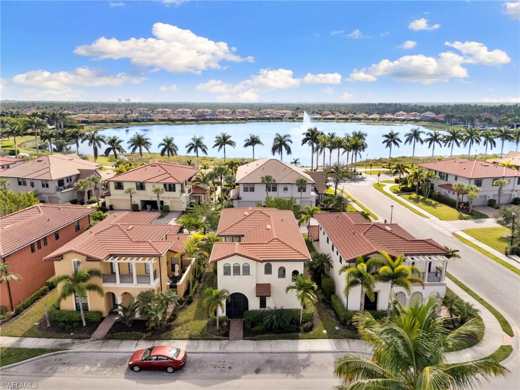 1350 Kendari Terrace Naples, FL 34113 - Photo 43 of 47 Aerial perspective of suburban area with a nearby body of water