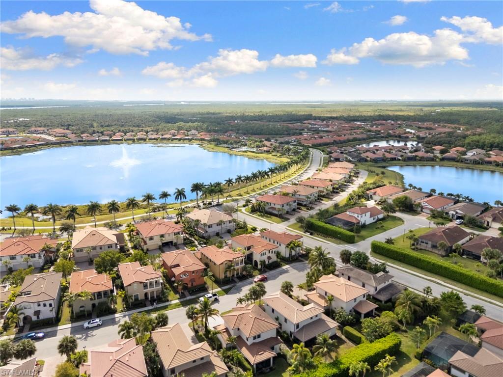 1350 Kendari Terrace Naples, FL 34113 - Photo 45 of 47 Aerial perspective of suburban area with a large body of water