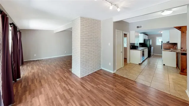 a view of a kitchen from the hallway