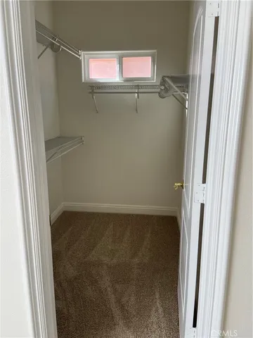 a kitchen with stainless steel appliances granite countertop a sink and a refrigerator