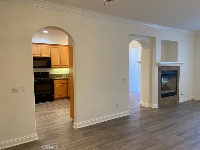 a view of a kitchen cabinets and wooden floor