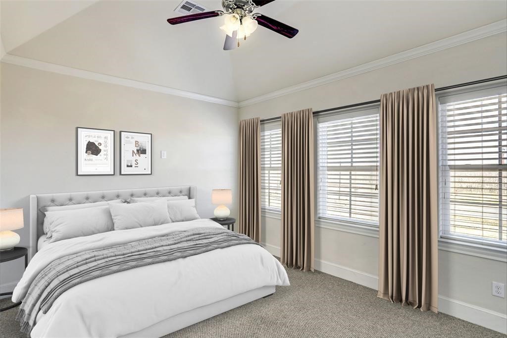 9676 Knight Road Houston, TX 77045 - Photo 5 of 11 a bedroom with a large bed and a window