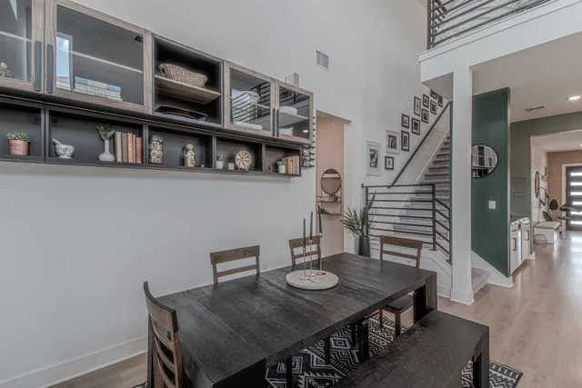a view of a dining room with furniture and wooden floor