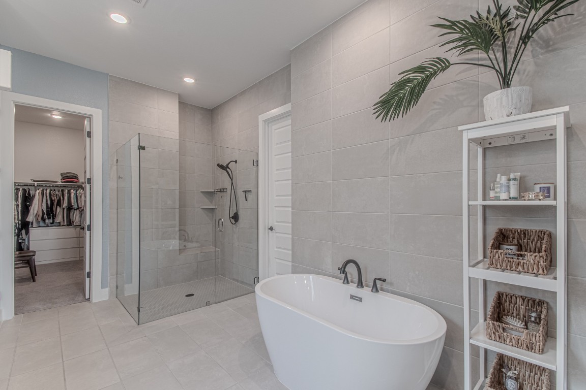 308 Millbend Road Georgetown, TX 78633 - Photo 15 of 40 a bathroom with a bathtub and a shower