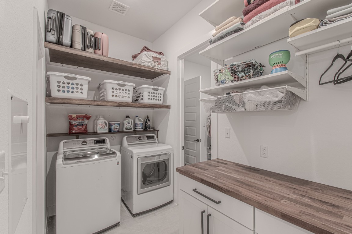 308 Millbend Road Georgetown, TX 78633 - Photo 19 of 40 a view of a storage & utility room with washer and dryer