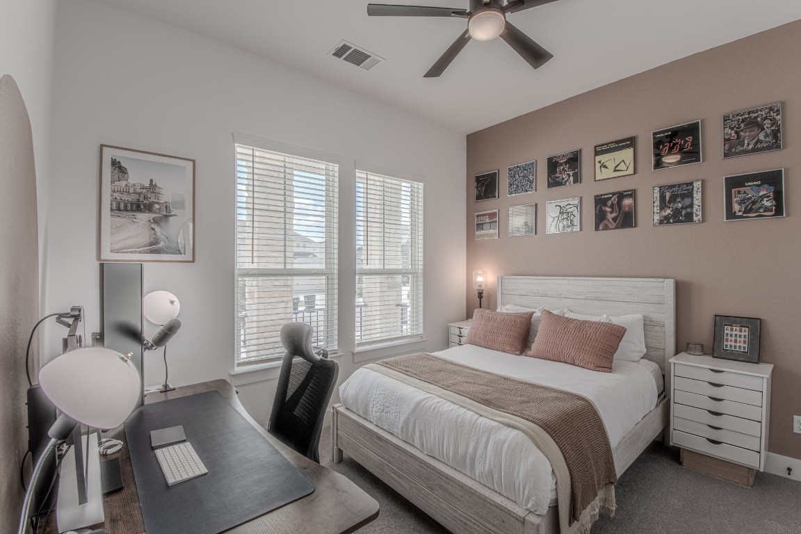 308 Millbend Road Georgetown, TX 78633 - Photo 20 of 40 a bedroom with a bed and a table in it
