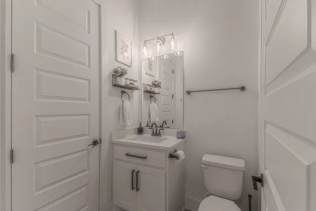 a view of a livingroom with furniture and a flat screen tv