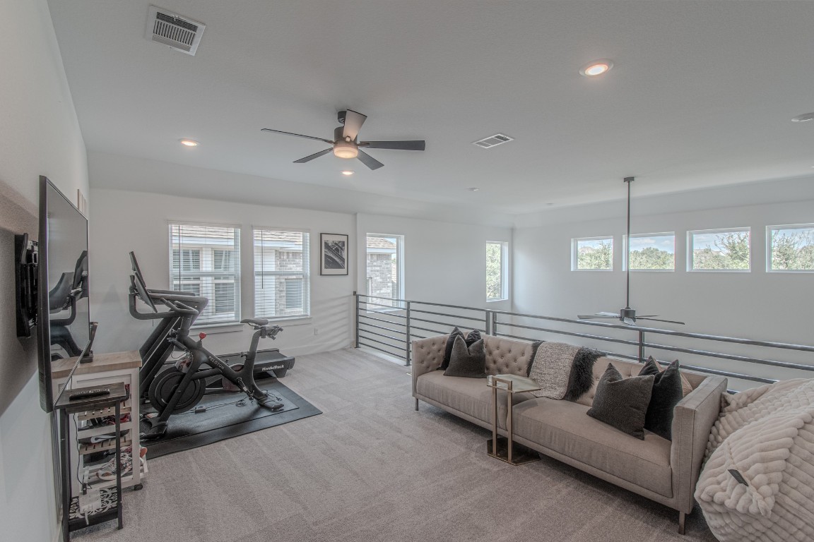 308 Millbend Road Georgetown, TX 78633 - Photo 22 of 40 a view of a livingroom with furniture and a flat screen tv