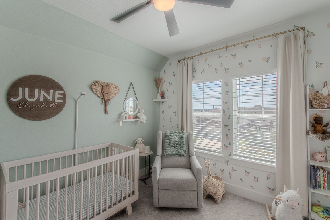 308 Millbend Road Georgetown, TX 78633 - Photo 29 of 40 a bedroom with furniture and a large window