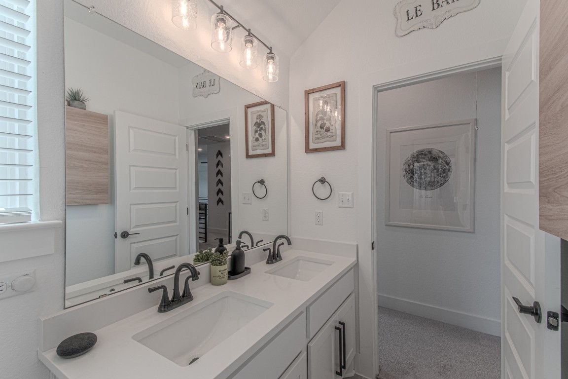 308 Millbend Road Georgetown, TX 78633 - Photo 32 of 40 a bathroom with a sink and a mirror