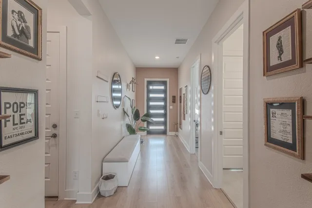 a kitchen with a sink a counter top space stainless steel appliances and a large window