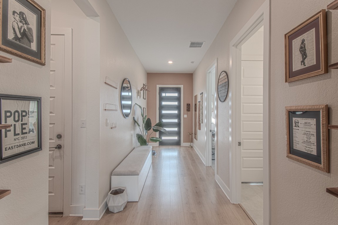 308 Millbend Road Georgetown, TX 78633 - Photo 5 of 40 a view of entryway with stairs and wooden floor