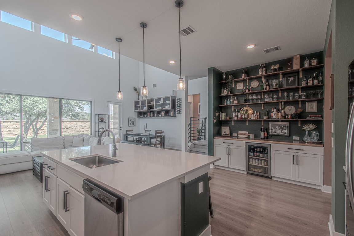 308 Millbend Road Georgetown, TX 78633 - Photo 40 of 40 a kitchen with a sink a counter top space stainless steel appliances and a large window