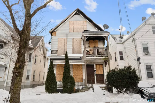 a view of a white building among the street